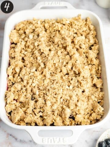 berry crisp in a baking dish before baking.