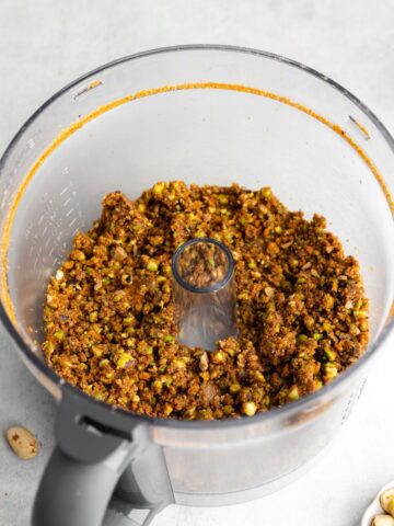 biscoff pistachio cookie crust in a food processor jug.