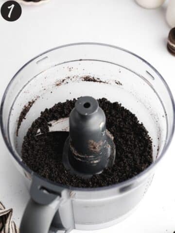 oreo cookies, vegan butter, and salt mixed in a food processor to a fine crumb consistency.