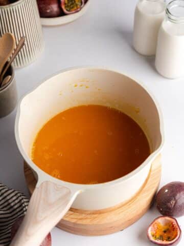 passion fruit juice and sugar heated in a saucepan.