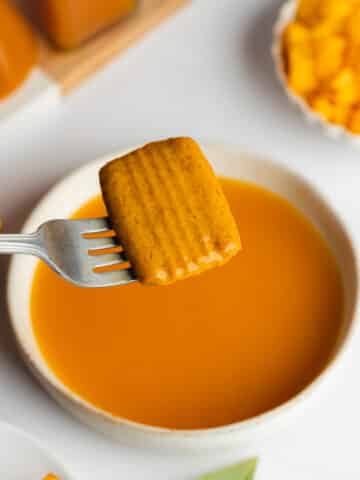 dipping cookies in a mango soak before adding to tiramisu.