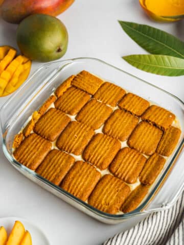 third layer of soaked cookies lined in a glass dish.