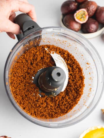 biscoff cookie crumbs and vegan butter in a food processor.