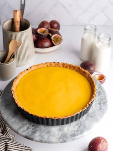 passion fruit curd filled shortcrust pastry shell before going into the fridge to chill and set.
