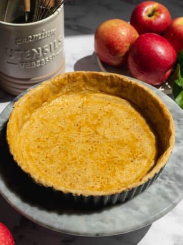 a par-baked pastry shell brushed with apricot jam before adding frangipane filling.