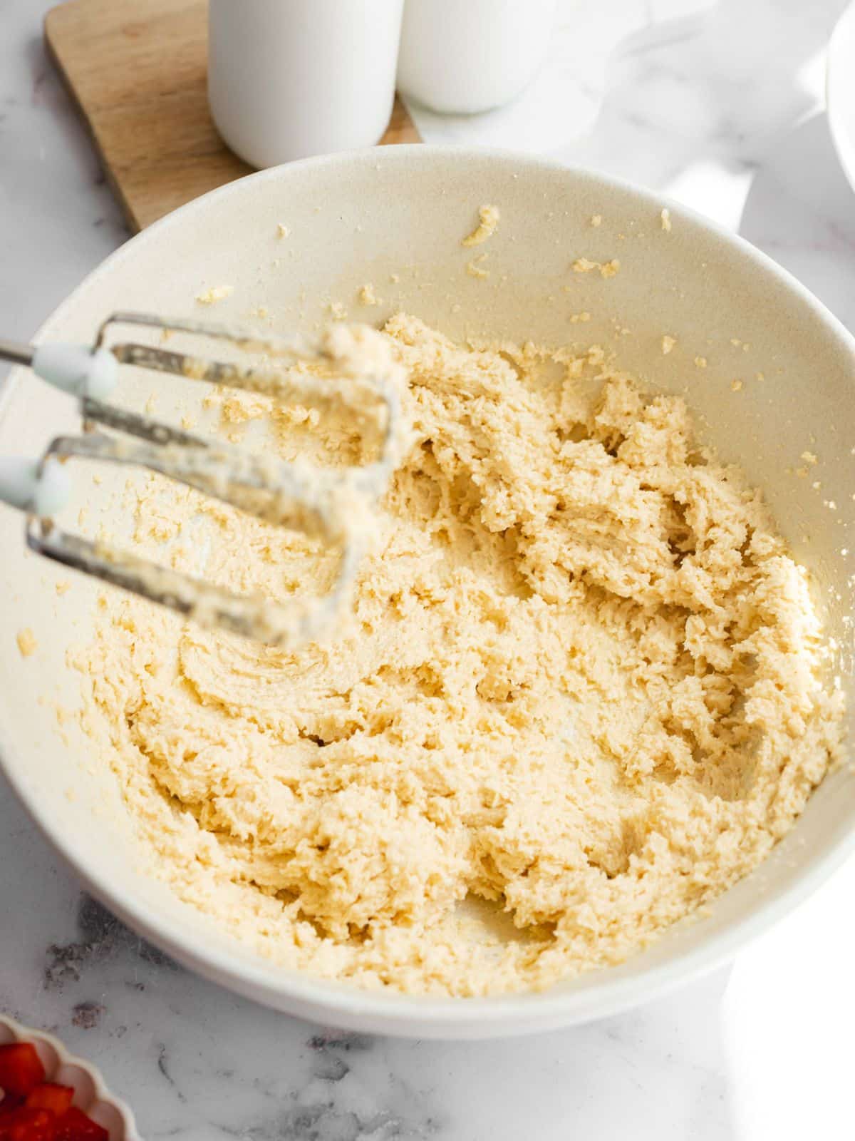vegan butter and sugar creamed in a mixing bowl.