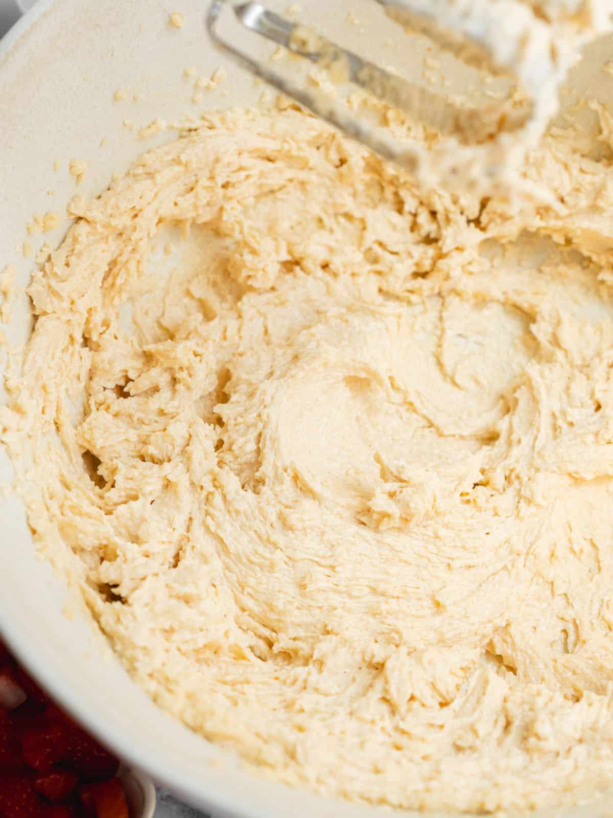 vegan butter, sugar, yogurt, and vanilla whisked in a arge bowl.