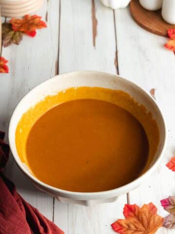a large ceramic with whisked pumpkin puree, olive oil, vanilla, sugar, and vegan buttermilk.
