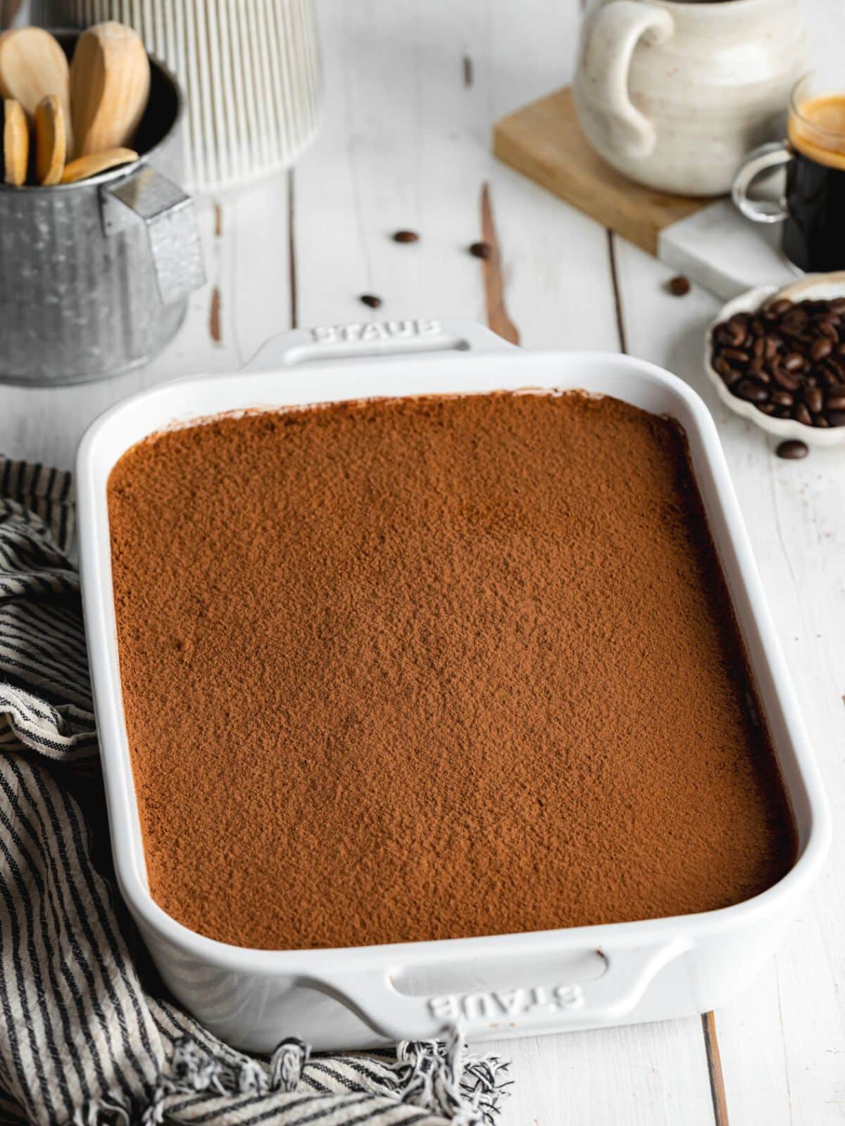 nutella tiramisu dusted in cocoa powder in a staub pan.