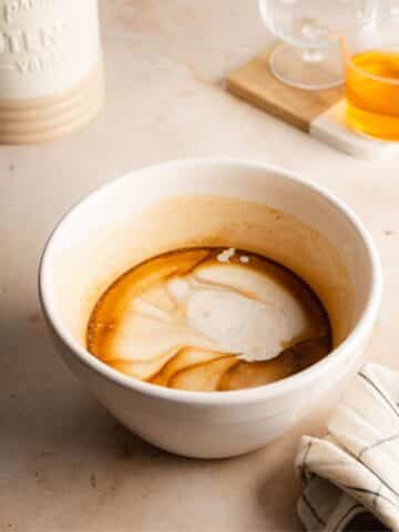 soy cream and oat cream poured on top of the condensed milk mixture.
