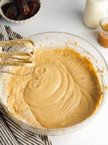 creamy cake batter for sticky toffee pudding in a mixing bowl.