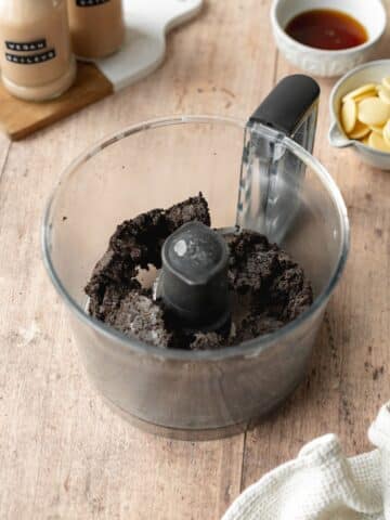 oreo cookies and vegan butter blitzed in a food processor to form cheesecake crust.