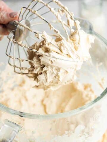 brown sugar frosting whipped until smooth and fluffy in a stand mixer with glass bowl and whisk attachment.
