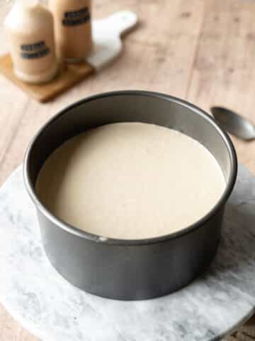 baileys cheesecake in a cake pan before going into the fridge to set.