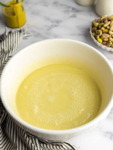 pistachio three milk syrup in a white bowl.