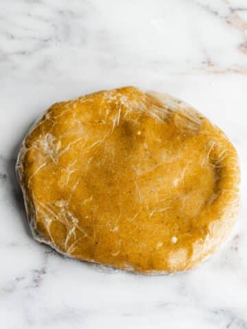 gingerbread pastry wrapped in plastic wrap before chilling in the fridge.