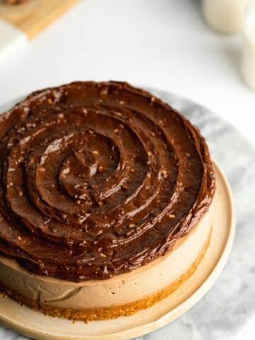 hazelnut cheesecake topped with swirled ganache.
