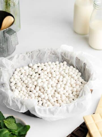 pie weights in a tart base.