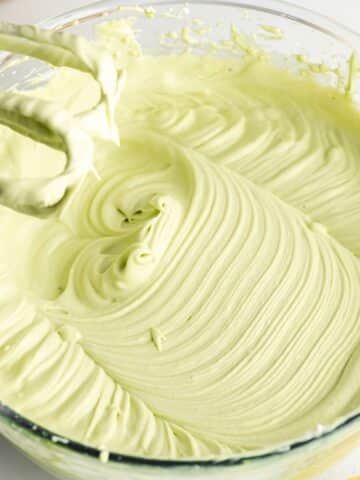 matcha tiramisu filling whisked using an electric mixer.