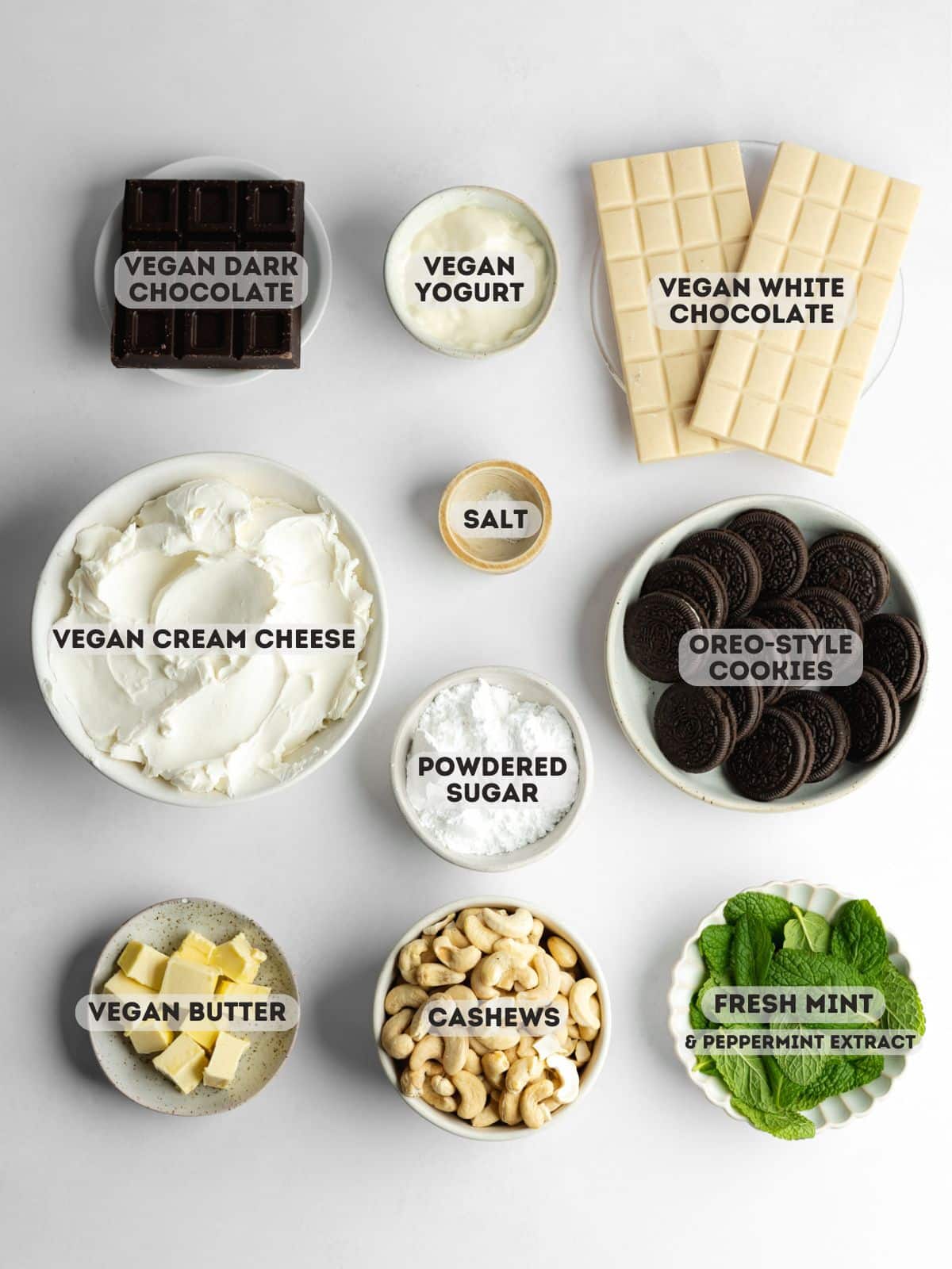 ingredients for matcha tiramisu measured out in bowls on a gray surface.