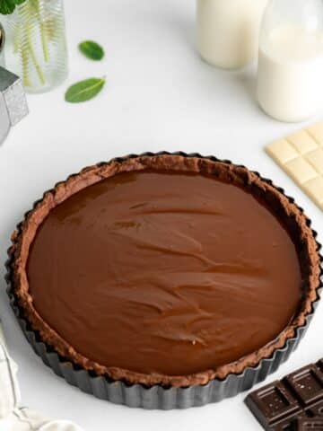 chocolate ganache poured into a chocolate shortcrust pastry shell.