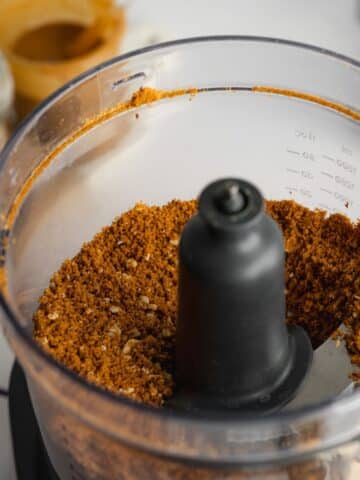 hazelnuts and cookies ground down to fine crumbs in a food processor.