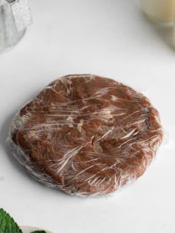 chocolate pastry wrapped in plastic wrap.