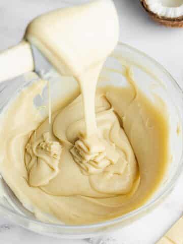 thick white chocolate ganache in a bowl after chilling.