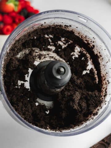 oreo cookie crust ingredients blitzed to fine crumbs in a food processor jug.