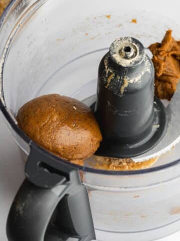 date paste formed into a uniform ball in a food processor jug.