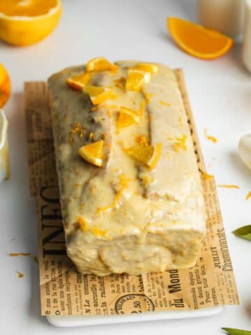 orange cake glazed with fresh orange icing and topped with orange segments.