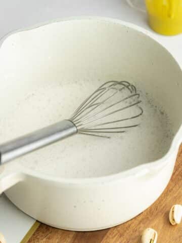 cornstarch, sugar, and almond milk whisked in a small saucepan.