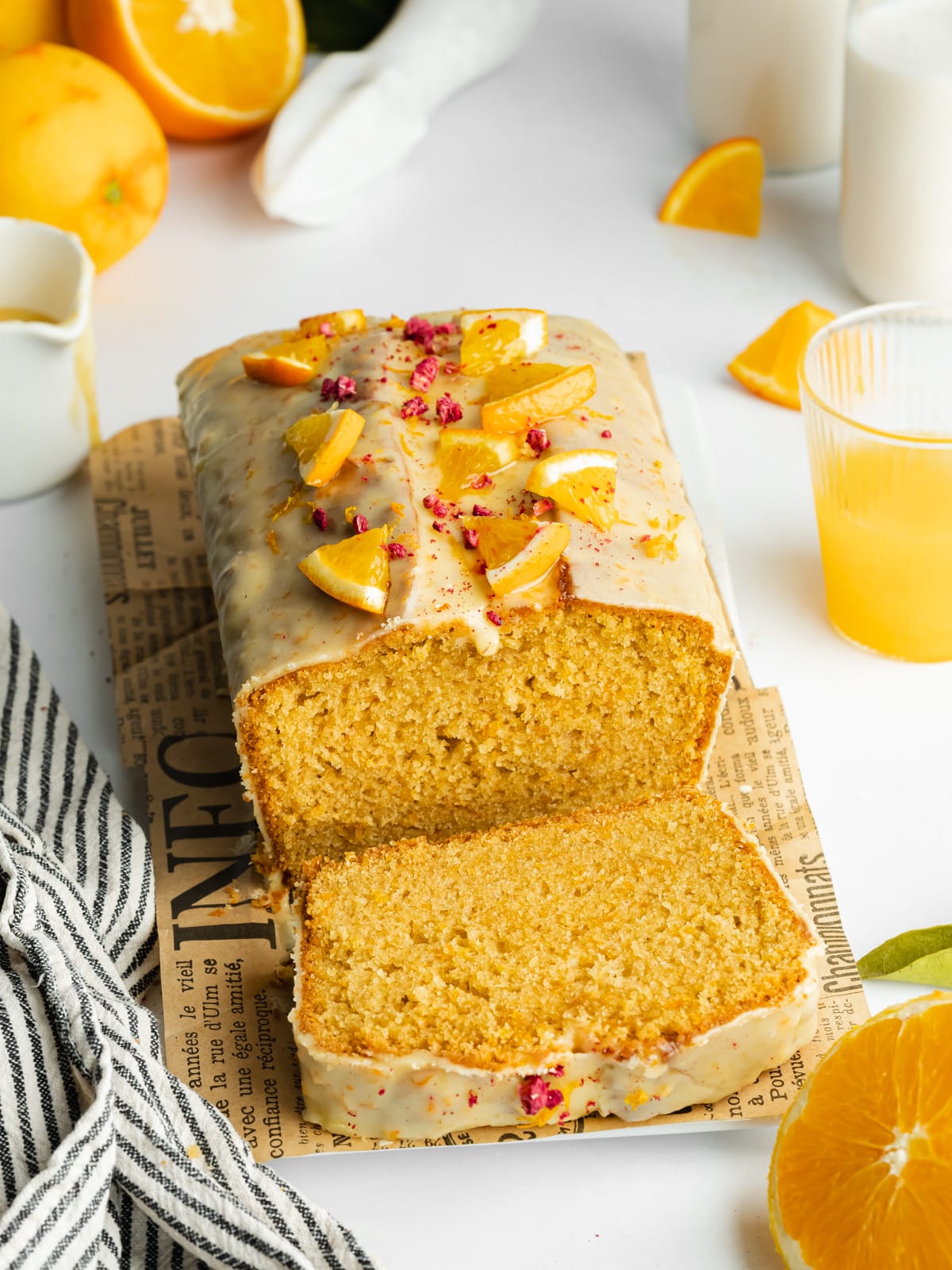 orange loaf with a slice cut showing the bright orange crumb inside.