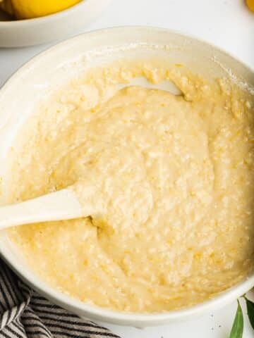 lemon cake batter in a large bowl before adding poppyseeds.