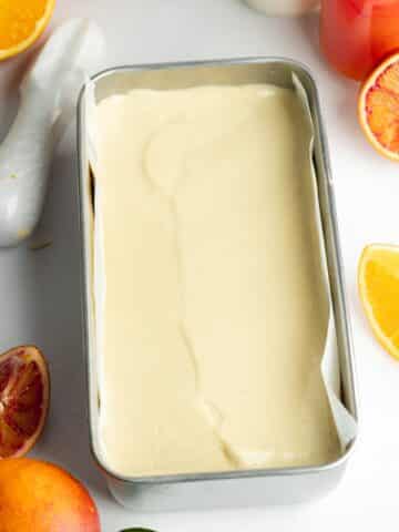 orange cream cheese filling in a loaf pan before setting in the fridge.