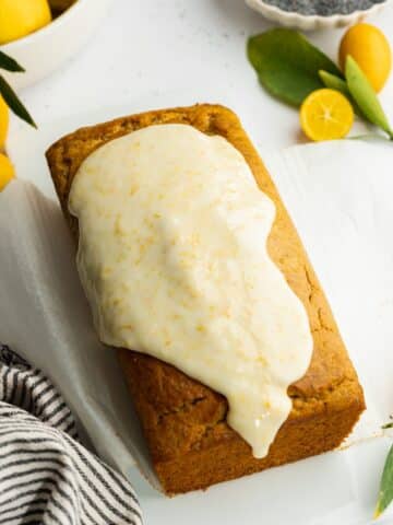 a poppyseed loaf with lemon icing poured over the top.