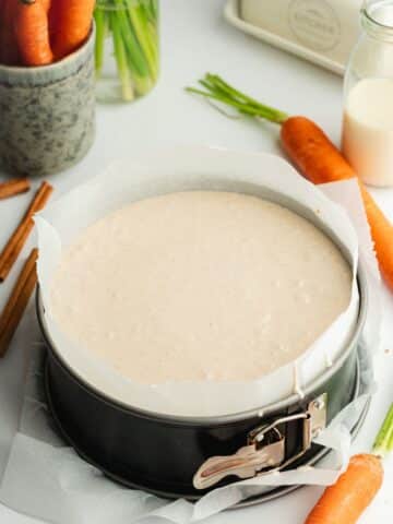carrot cheesecake batter in a lined pan before going into the fridge to set.