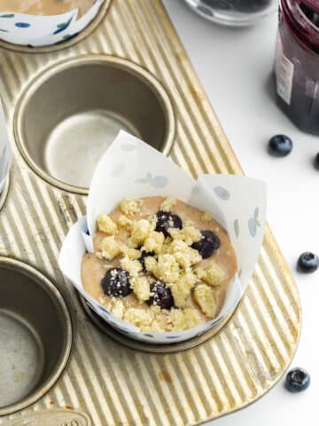 blueberry muffins in tulip liners before baking.