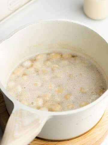 macadamias simmering in a saucepan.