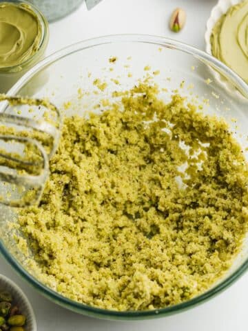 ground pistachios, sugar, and butter creamed in a large mixing bowl.