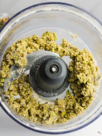 pistachio crumble in a food processor jug.