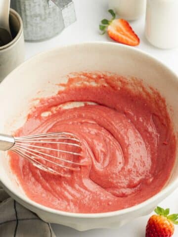 strawberry sugar, oil, yogurt and vanilla whisked into a smooth pink paste in a large ceramic bowl.