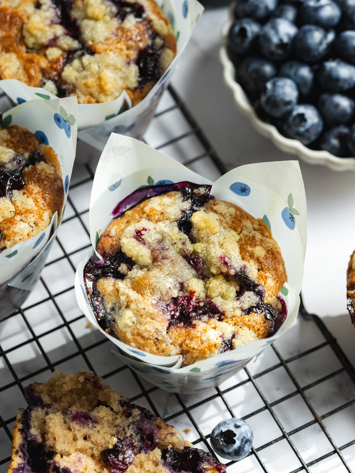 blueberry muffins cooling on a wire rack.