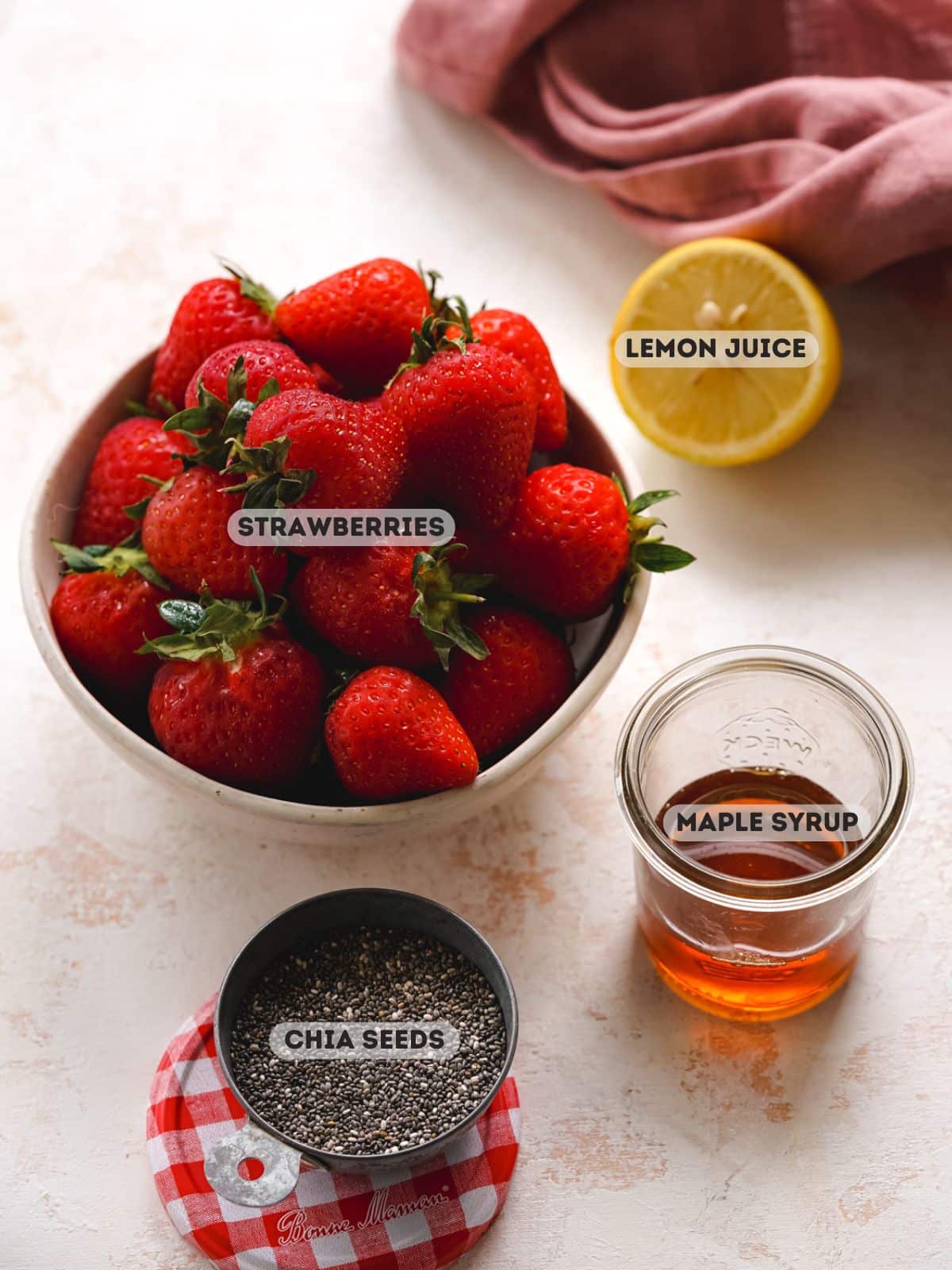 ingredients for chia jam measured in bowls.