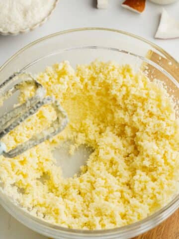 softened vegan butter and sugar creamed in a glass bowl.