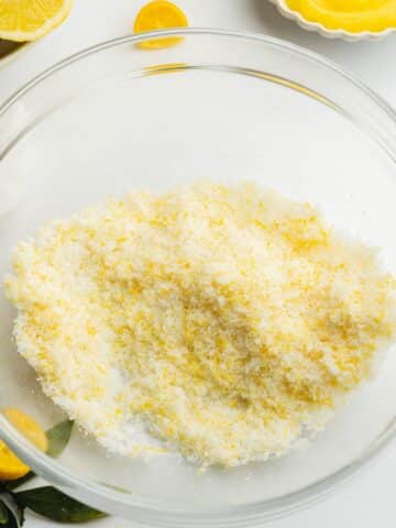 lemon zest rubbed into sugar in a clear bowl.