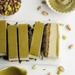 dubai pistachio cheesecake cut into slices.