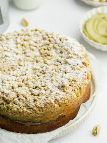 pistachio coffee cake dusted with icing sugar.