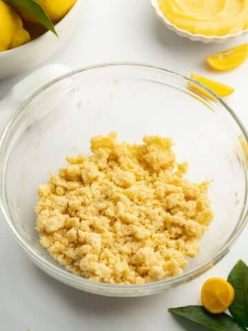 lemon crumble topping in a clear mixing bowl.