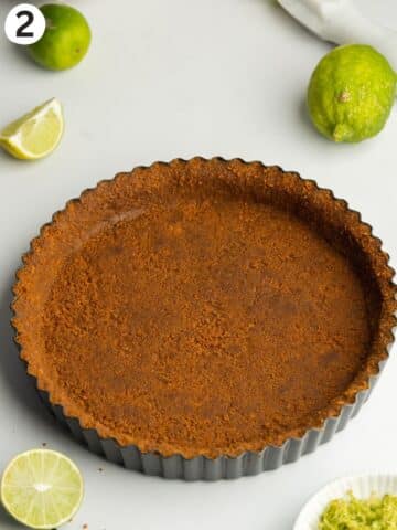 biscoff cookie crust pressed into a tart pan.